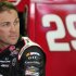 Driver Kevin Harvick looks on in the garage during preparations for Sunday's NASCAR Spint Cup auto race, Friday, Sept. 2, 2011, at the Atlanta Motor Speedway, in Hampton, Ga. (AP Photo/Rainier Ehrhardt)