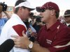 FILE - In this Sept. 11, 2010, file photo, Oklahoma head coach Bob Stoops, left, greets Florida State head coach Jimbo Fisher following an NCAA college football game in Norman, Okla. Fisher believes his coaches and players learned a lot from last year's 47-17 loss to Oklahoma and are ready to challenge the top-ranked Sooners on Saturday, Sept. 17, 2011, on their own field this time. (AP Photo/Sue Ogrocki, File)