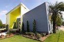 ADVANCE FOR WEEKEND EDITIONS APRIL 21-22 - In a Thursday, April 5, 2012 photo, the Roese Sunshower SSIP house is seen in New Orleans. The house is meant to go up quickly after disasters and then serve as permanent housing that can withstand future calamities. It's designed to be environmentally friendly, survive outside damaged utility grids and can be shipped in pieces in a single container and assembled like an erector set. (AP Photo/Gerald Herbert)