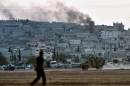 Smoke rises from the city centre of the Syrian town of Ain al-Arab, known as Kobane by the Kurds, on October 7, 2014