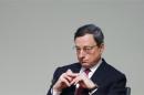 ECB President Draghi waits to deliver a speech at a conference in Brussels