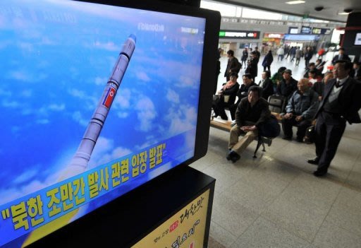 North Korea says its satellite failed to enter orbit, while the South says the rocket was a missile test that failed