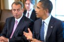 Speaker of the House John Boehner (L) listens as US President Barack Obama delivers a statement on Syria