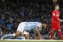 Manchester City's Raheem Sterling gets up from the back of the net after falling over attempting a shot on goal during the English Premier League soccer match between Manchester City and Liverpool at the Etihad Stadium, Manchester, England, Saturday, Nov. 21, 2015.Liverpool won the game 4-1. (AP Photo/Jon Super)