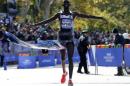 Wilson Kipsang of Kenya crosses finish line to win men's professional division of the 2014 New York City Marathon in Central Park in Manhattan