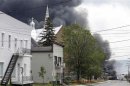 A cloud of smoke is seen over Lac Megantic after a train explosion