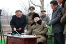 North Korean leader Kim Jong Un gives instruction during a simulated test of atmospheric re-entry of a ballistic missile