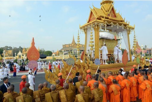 Buddhist monks pray during a funeral procession for Norodom Sihanouk in Phnom Penh, on February 1, 2013