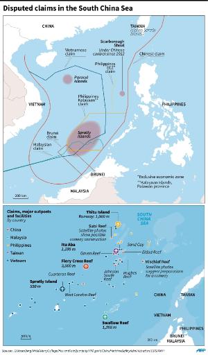 Map showing disputed claims in the South China Sea, …