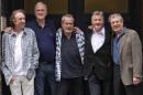 British comedy troupe Monty Python, (L-R) Eric Idle, John Cleese, Terry Gilliam, Michael Palin, and Terry Jones pose for a photograph at the back door to the London Palladium in central London on June 30, 2014