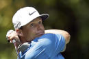 Nick Watney watches his tee shot on the second hole during the third round of the Wyndham Championship golf tournament in Greensboro, N.C., Saturday, Aug. 16, 2014. (AP Photo/Chuck Burton)