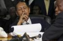 Former Haitian dictator Duvalier listens as charges against him are announced during an appeals court hearing in Port-au-Prince