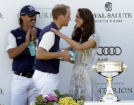 Kate, the Duchess of Cambridge congratulates her husband Prince William, Duke of Cambridge at the trophy ceremony after his team won the charity polo match at The Santa Barbara Polo & Racquet club on Saturday, July 9, 2011 in Carpinteria Calif. The event was held in support of The American Friends of The Foundation of Prince William and Prince Harry. (AP Photo/Jae Hong)