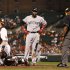 Boston Red Sox's David Ortiz, center, reacts after home plate umpire Laz Diaz called Ortiz striking out looking in the third inning of a baseball game on Monday, Sept. 26, 2011, in Baltimore. (AP Photo/Patrick Semansky)