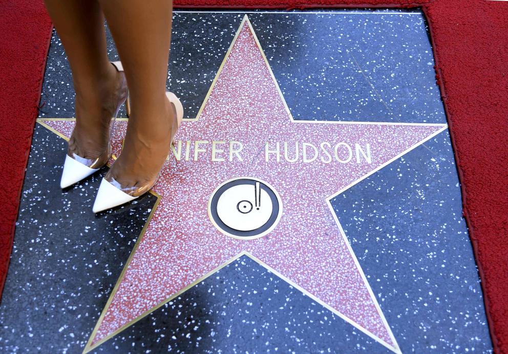 U.S. actress and singer Jennifer Hudson poses on her star after it was unveiled on the Walk of Fame in Hollywood