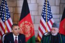 US President Barack Obama (L) speaks before signing a strategic partnership agreement with Afghan President Hamid Karzai