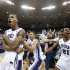 TCU forward Garlon Green, left, and guards Clyde Smith, and Nate Butler Lind (21) celebrate with the fans on the court after an NCAA college basketball game against Kansas on Wednesday, Feb. 6, 2013, in Fort Worth, Texas. TCU won 62-55. (AP Photo/Sharon Ellman)