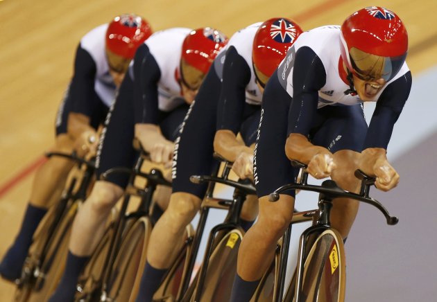 Britain's Edward Clancy, Geraint Thomas, Steven Burke and Peter Kennaugh compete on the last lap of their track cycling men's team pursuit qualifiers at the Velodrome during the London 2012 Olympic Ga