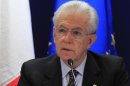 Italy's Prime Minister Mario Monti arrives at a news conference after a European Union leaders summit in Brussels