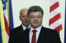 Ukraine's President Poroshenko and U.S. Vice President Biden walk into a hall before a news conference in Kiev