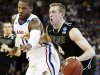 Kansas forward Thomas Robinson (0) covers Purdue forward Robbie Hummel (4) during the first half of a third-round NCAA college basketball tournament game at CenturyLink Center in Omaha, Neb., Sunday, March 18, 2012. (AP Photo/Orlin Wagner)