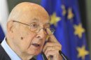 Italy's President Napolitano rubs his eye as he speaks at a news conference during his visit in Brdo near Kranj