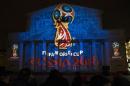 The official logo for the 2018 FIFA World Cup is presented on the facade of the Bolshoi Theatre in Moscow, Russia, Wednesday, Oct. 29, 2014. FIFA President Sepp Blatter has revealed the logo for the 2018 World Cup in Russia - with the help of a crew of cosmonauts. The logo depicts the World Cup trophy in red and blue, colors from the Russian flag, with gold trim. (AP Photo/Pavel Golovkin)