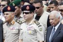 Army Chief General al-Sisi and interim PM el-Beblawi attend the military funeral service of Police General Farag in Nasr City