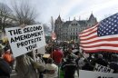 People protest during the Guns Across America pro-gun rally at the State Capitol in Albany
