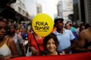 Girl holds a balloon that reads "Out Temer", referring to Brazil's President Michel Temer, during a protest against a constitutional amendment, known as PEC 55, that limits public spending, in Sao Paulo