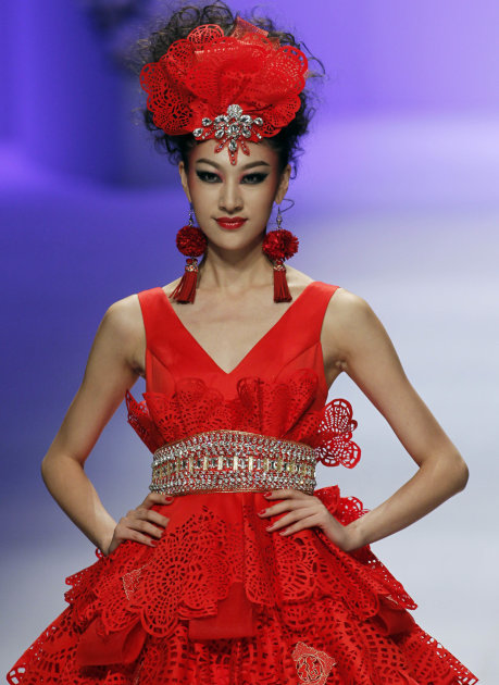 A Chinese model wears a creation of Taiwanese designer Tsai Meiyue during a fashion show in Beijing, China, Sunday, Oct. 30, 2011. (AP Photo/Ng Han Guan)