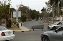 A bench stands as a makeshift roadblock close to the headquarters of the Libyan General National Congress in Tripoli