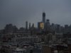 One World Trade Center and large portions of lower Manhattan and Hoboken, N.J., are seen without power from Jersey City, N.J., Tuesday, Oct. 30, 2012, the morning after a powerful storm that started out as Hurricane Sandy made landfall on the East Coast. New York City awakened Tuesday to a flooded subway system, shuttered financial markets and hundreds of thousands of people without power a day after a wall of seawater and high winds slammed into the city, destroying buildings and flooding tunnels. (AP Photo/Charles Sykes)