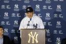 New York Yankees pitcher Masahiro Tanaka, of Japan, speaks as Yankees owner Hal Steinbrenner, left, watches him during a news conference at Yankee Stadium Tuesday, Feb. 11, 2014, in New York. (AP Photo/Frank Franklin II)