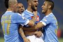 Napoli's Lorenzo Insigne, third from left, celebrates with teammates Marek Hamsik, left, Gokhan Inler, second from left, and Raul Albiol after scoring during the Italian Cup final match between Fiorentina and Napoli in Rome's Olympic stadium Saturday, May 3, 2014. (AP Photo/Gregorio Borgia)