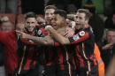 Bournemouth's Joshua King, centre, celebrates after scoring a goal during the English Premier League soccer match between Bournemouth and Manchester United at the Vitality Stadium in Bournemouth, England, Saturday Dec. 12, 2015. (AP Photo/Tim Ireland)