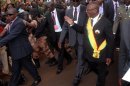 Malian new President Ibrahim Boubacar Keita (C) waves on September 4, 2013