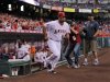 Los Angeles Angels' Albert Pujols runs out during introductions prior to a baseball game against the Kansas City Royals, Friday, April 6, 2012, in Anaheim, Calif. (AP Photo/Mark J. Terrill)