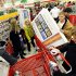 FILE - In this Nov. 25, 2011 file photo, shoppers scramble for door buster deals at Target, in Bowling Green, Ky. U.S. consumers spent at a lackluster rate in November as their incomes barely grew, suggesting that U.S. households may struggle to sustain their spending into 2012.(AP Photo/Daily News, Joe Imel, File)