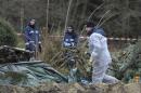 Police experts inspect the crime scene in Gimmlitztal near the town of Hartmannsdorf-Reichenau