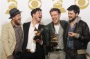 Mumford & Sons pose with their awards for Album of the Year and Best Long Form Music Video at the 55th annual Grammy Awards in Los Angeles