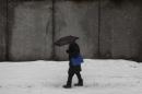 A man walks through the snow in New York