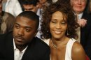 FILE - In this April 19, 2008 file photo, singers Ray J, left, and Whitney Houston attend the Bernard Hopkins and Joe Calzaghe, of Britain, light heavyweight boxing match at the Thomas & Mack center in Las Vegas. Ray J says he's 