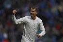 Real Madrid's Cristiano Ronaldo celebrates after scoring the opening goal against Sporting during a Spanish La Liga soccer match between Real Madrid and Sporting at the Santiago Bernabeu stadium in Madrid, Saturday, Nov. 26, 2016. Ronaldo scored twice in Real Madrid's 2-1 victory. (AP Photo/Francisco Seco)