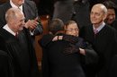 U.S. Supreme Court Justice Bader Ginsburg hugs President Obama as he arrives to deliver his State of the Union speech on Capitol Hill in Washington