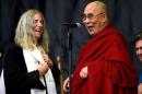 Patti Smith shares a light moment with the Dalai Lama as she performs on the Pyramid stage at Worthy Farm in Somerset during the Glastonbury Festival