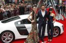Actor Hugh Jackman poses with Tao Okamoto and Rila Fukushima at the UK Premiere of The Wolverine at Leicester Square in London