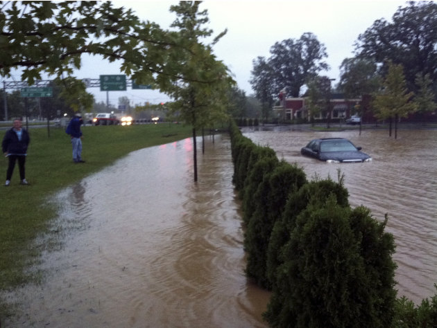 In this photo provided by Sarah Jones, a supermarket parking lot is flooded with rain water from Tropical Storm Irene in Bennington, Vt., Sunday Aug. 28, 2011. The remnants of Hurricane Irene dumped t