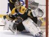 Bruins goalie Rask makes a glove save in the third period against Chicago in Game 3 of the NHL Stanley Cup Finals in Boston