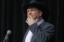 Garth Brooks pauses to compose himself as he thanks the crowd Tuesday, March 6, 2012, during the announcement that he will be inducted into the Country Music Hall of Fame in Nashville, Tenn. Brooks, Connie Smith, and Hargus 